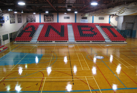 The new state-of-the-art seating now installed in the Russell Gamble Gymnasium in Prince Rupert proudly displays ANBT (All Native Basketball Tournament) lettering that is the cornerstone event held annually in the facility.